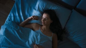 Woman sleeping soundly at night.